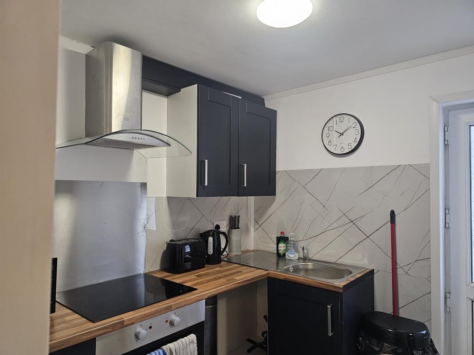 Kitchen or kitchenette, oven, stove, toaster
