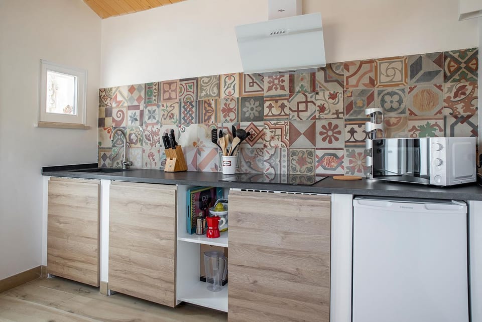 Kitchen or kitchenette, microwave, stove, toaster