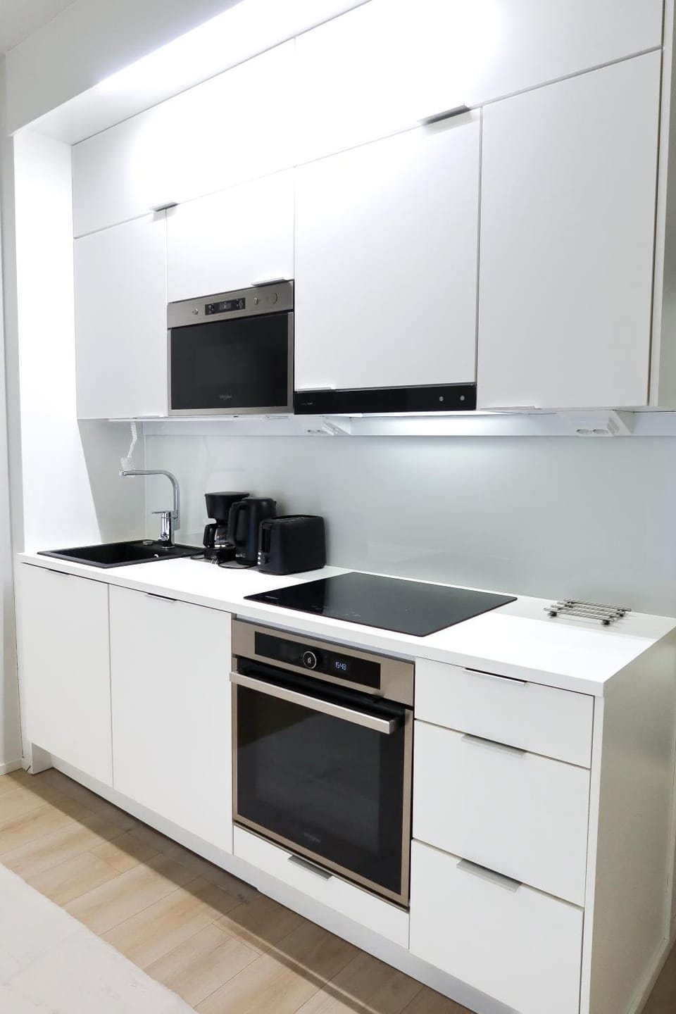 Kitchen or kitchenette, dishwasher, oven, stove