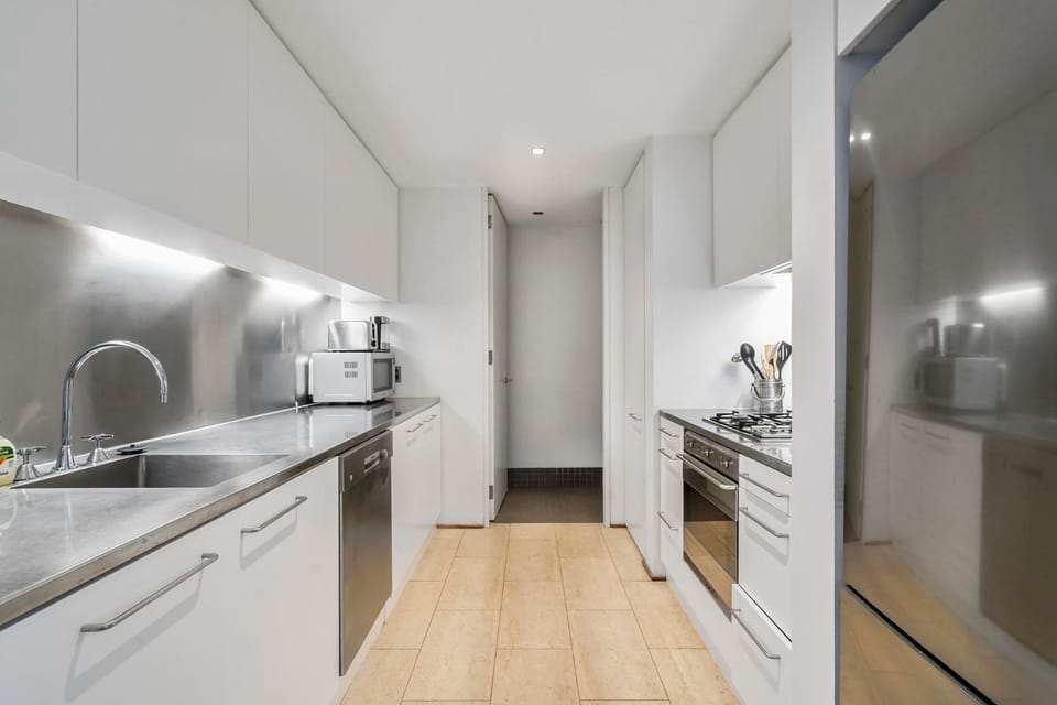 Kitchen or kitchenette, dishwasher, oven, stove