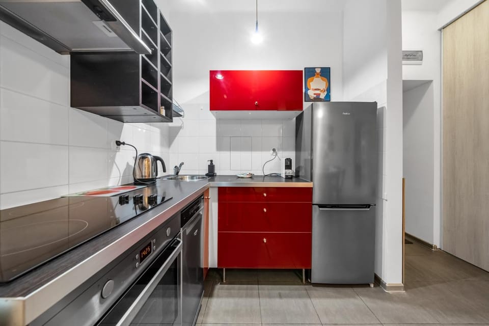 Kitchen or kitchenette, dishwasher, oven, stove