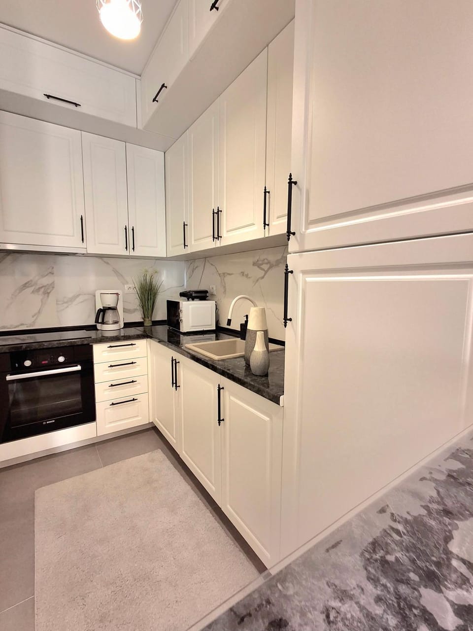 Kitchen or kitchenette, microwave, oven, stove, toaster
