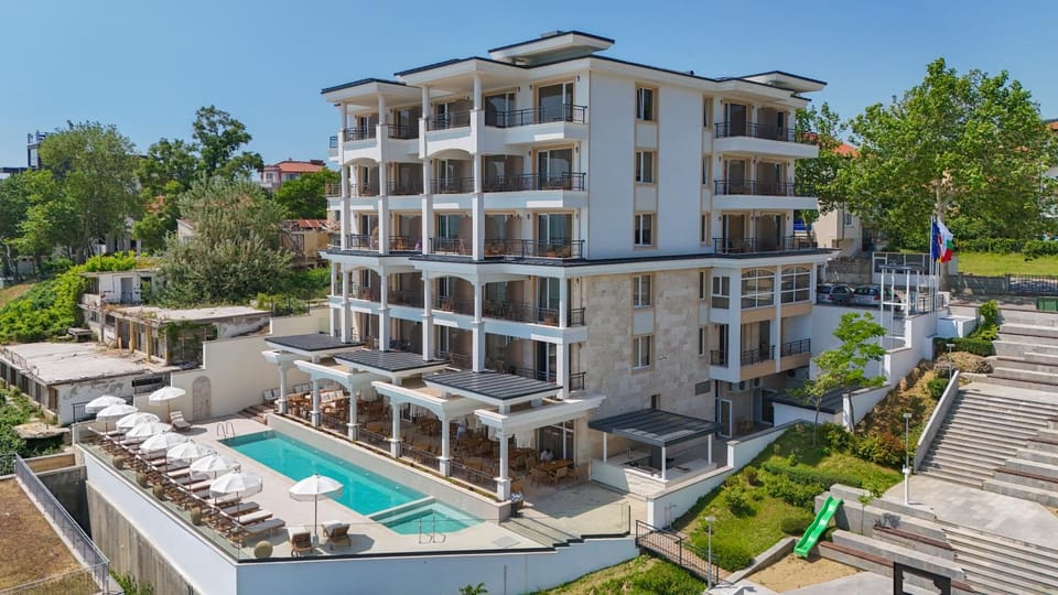 Property building, Patio, Spring, Day, View (from property/room), Balcony/Terrace, Pool view, Swimming pool, sunbed