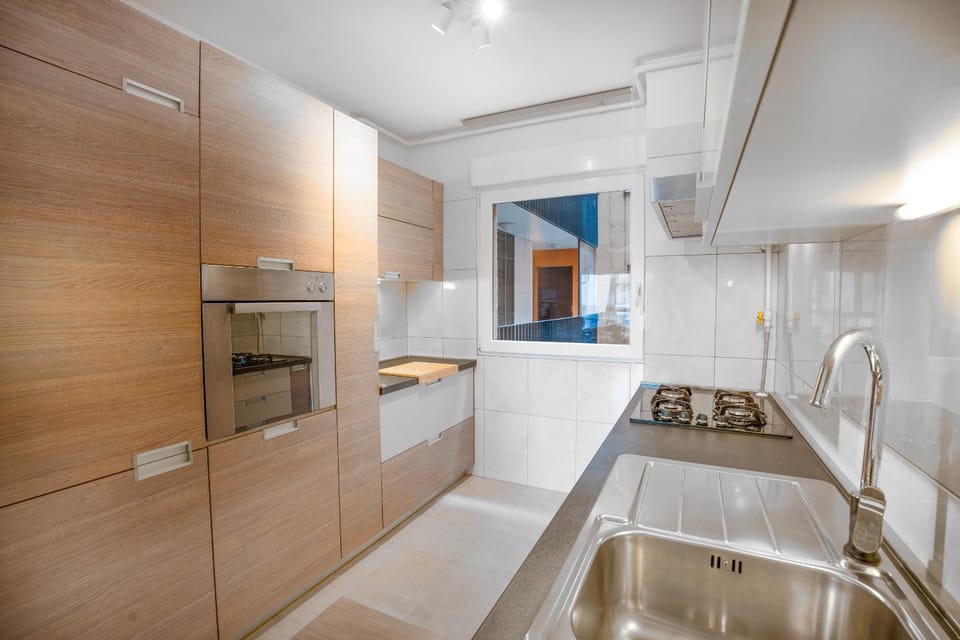 Kitchen or kitchenette, dishwasher, oven, stove