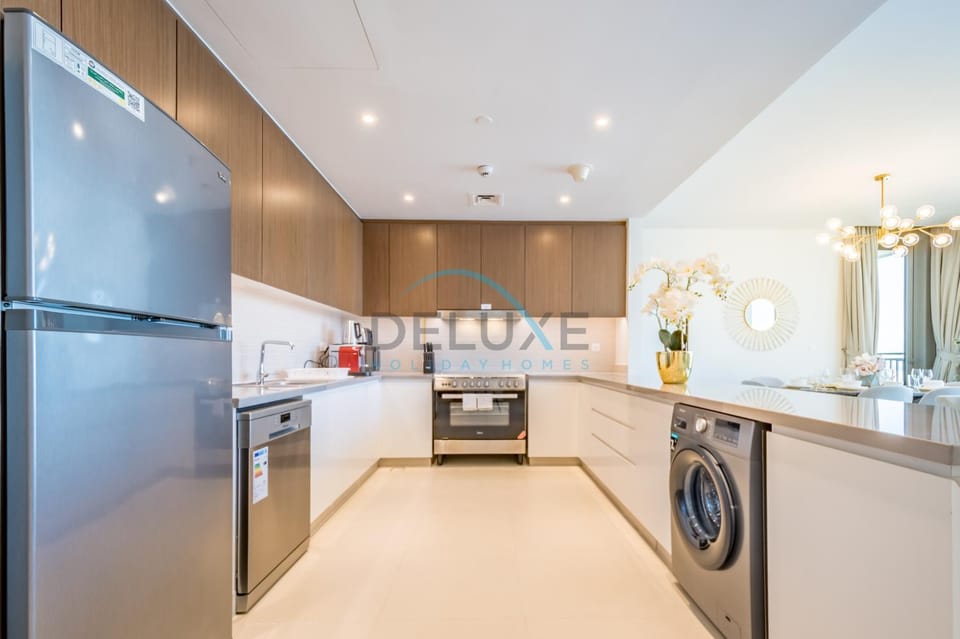 Kitchen or kitchenette, dishwasher, oven, stove, toaster, washing machine