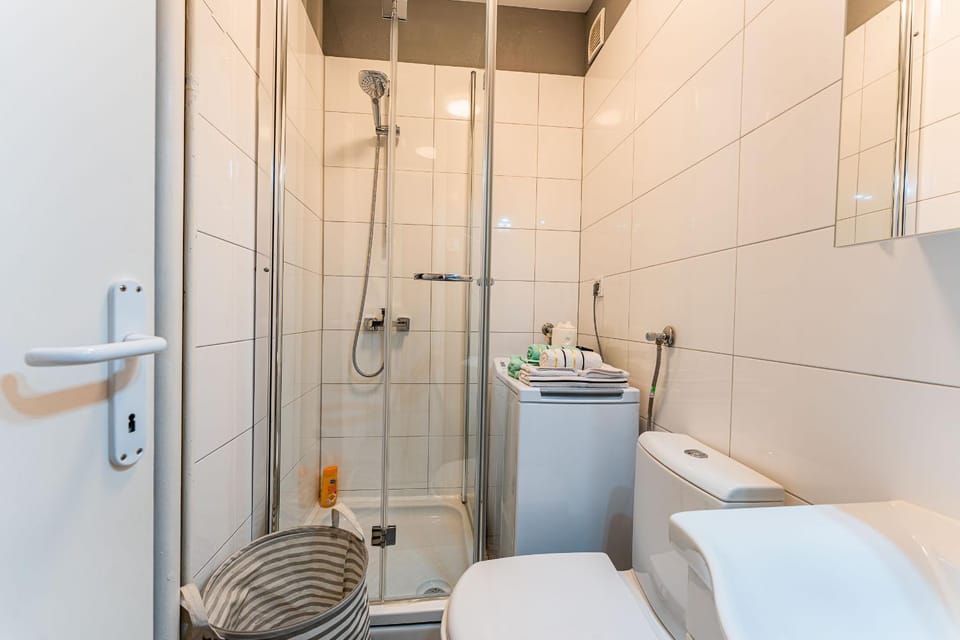 Shower, Toilet, Bathroom, towels, washing machine, dryer