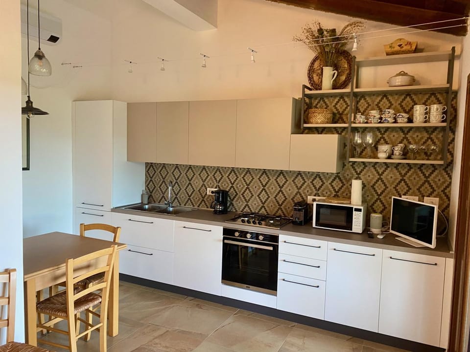 Kitchen or kitchenette, dishwasher, oven, stove