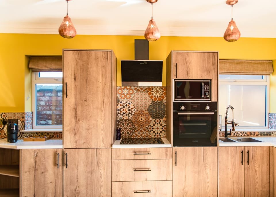 Kitchen or kitchenette, dishwasher, microwave, oven, stove