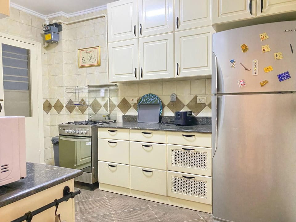 Kitchen or kitchenette, dishwasher, oven, stove