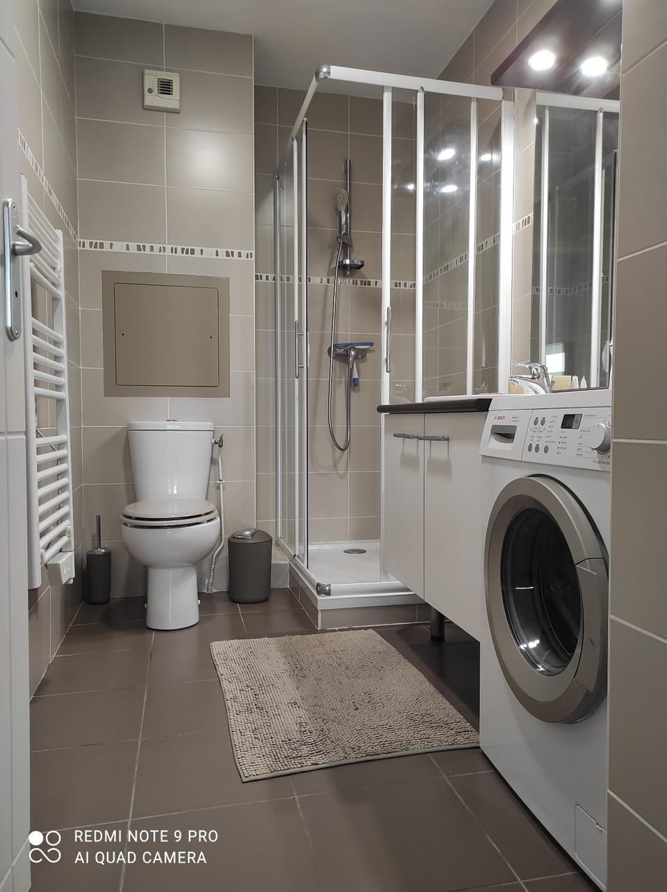 Shower, Toilet, Bathroom, towels, washing machine, dryer