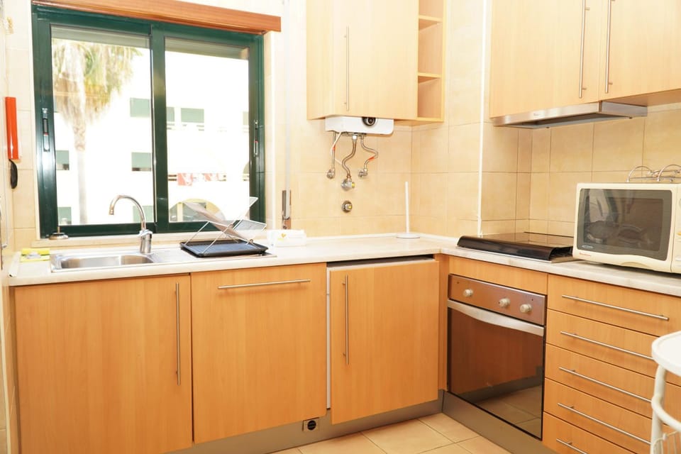 Kitchen or kitchenette, microwave, oven