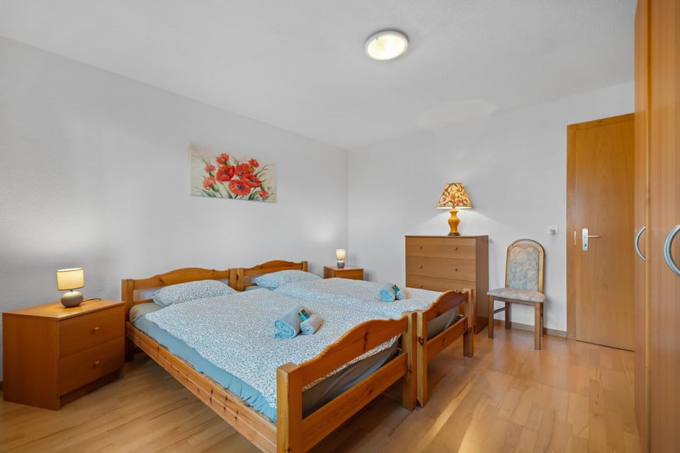 Bed, storage, towels, wardrobe