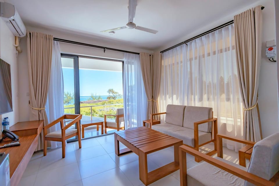 View (from property/room), Living room, Seating area, Sea view, air conditioner
