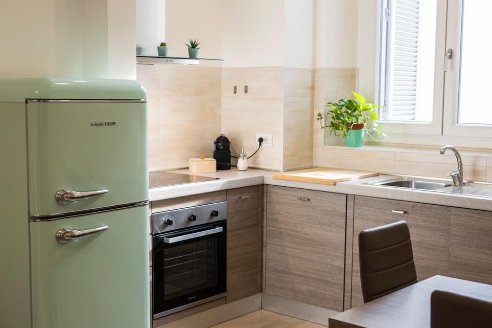 Kitchen or kitchenette, dishwasher, oven, stove