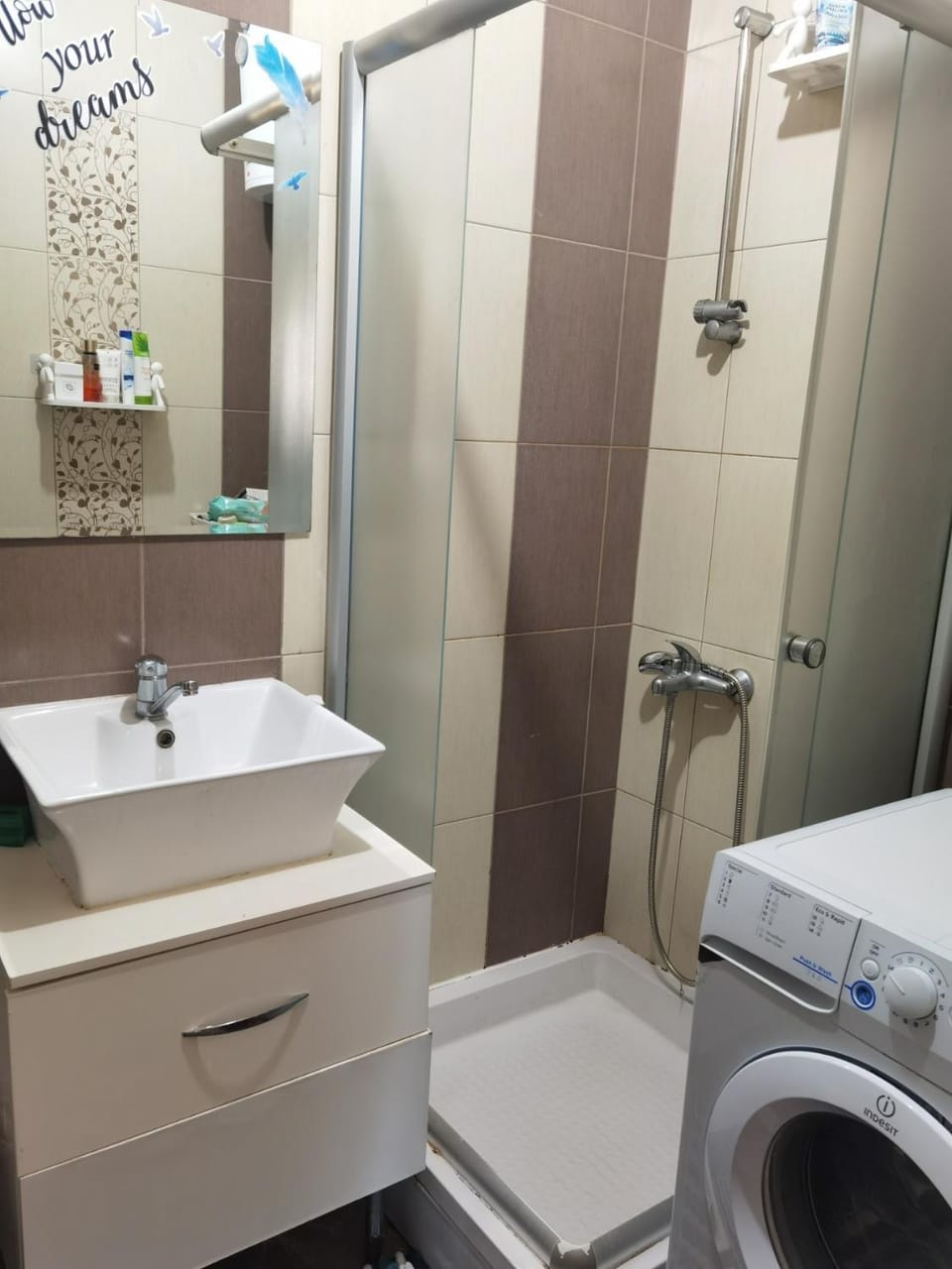 Shower, Toilet, towels, washing machine, dryer