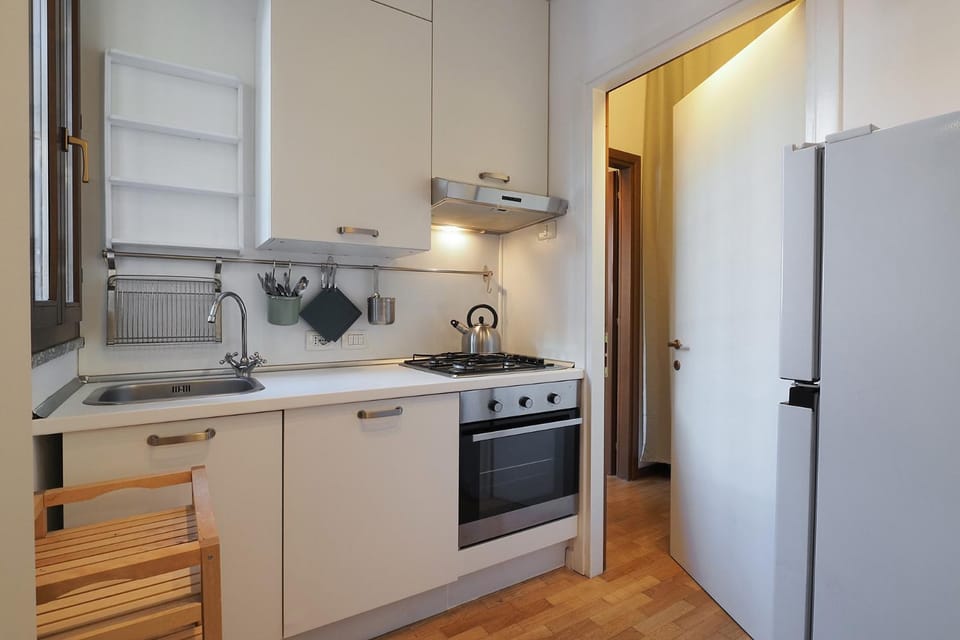 Kitchen or kitchenette, dishwasher, oven, stove