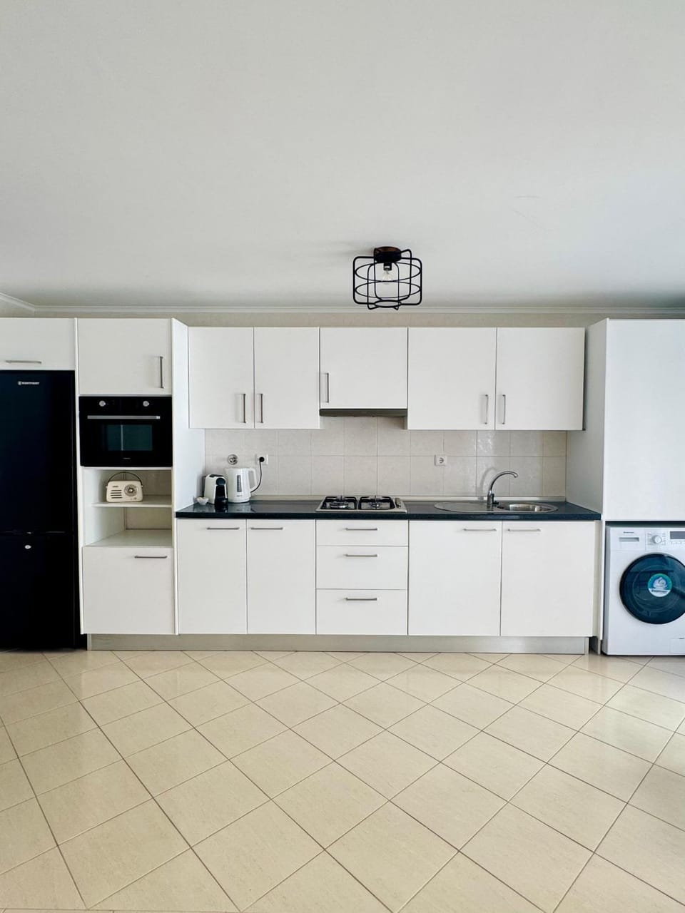 Kitchen or kitchenette, dishwasher, oven, stove