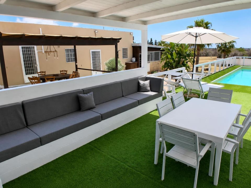 Property building, Patio, Day, View (from property/room), Balcony/Terrace, Living room, Seating area, Dining area, Pool view, Swimming pool, sunbed