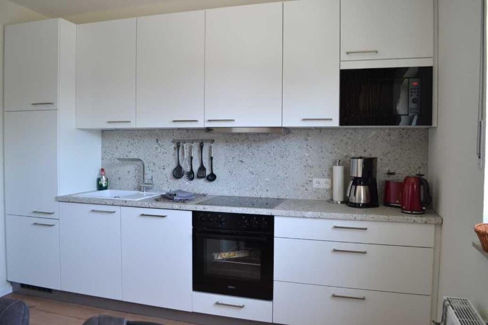 Kitchen or kitchenette, oven, stove, toaster