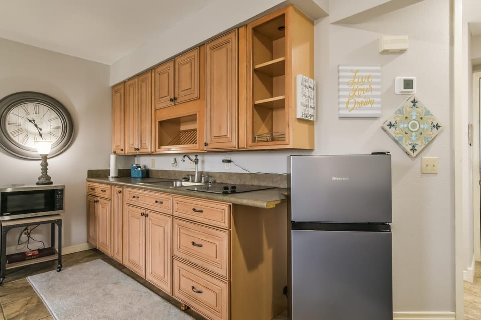 Kitchen or kitchenette, dishwasher, oven, stove