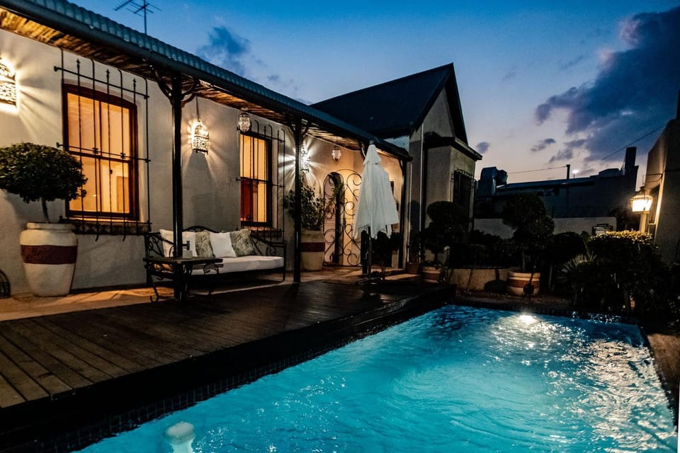 Property building, Patio, Night, Swimming pool, sunbed