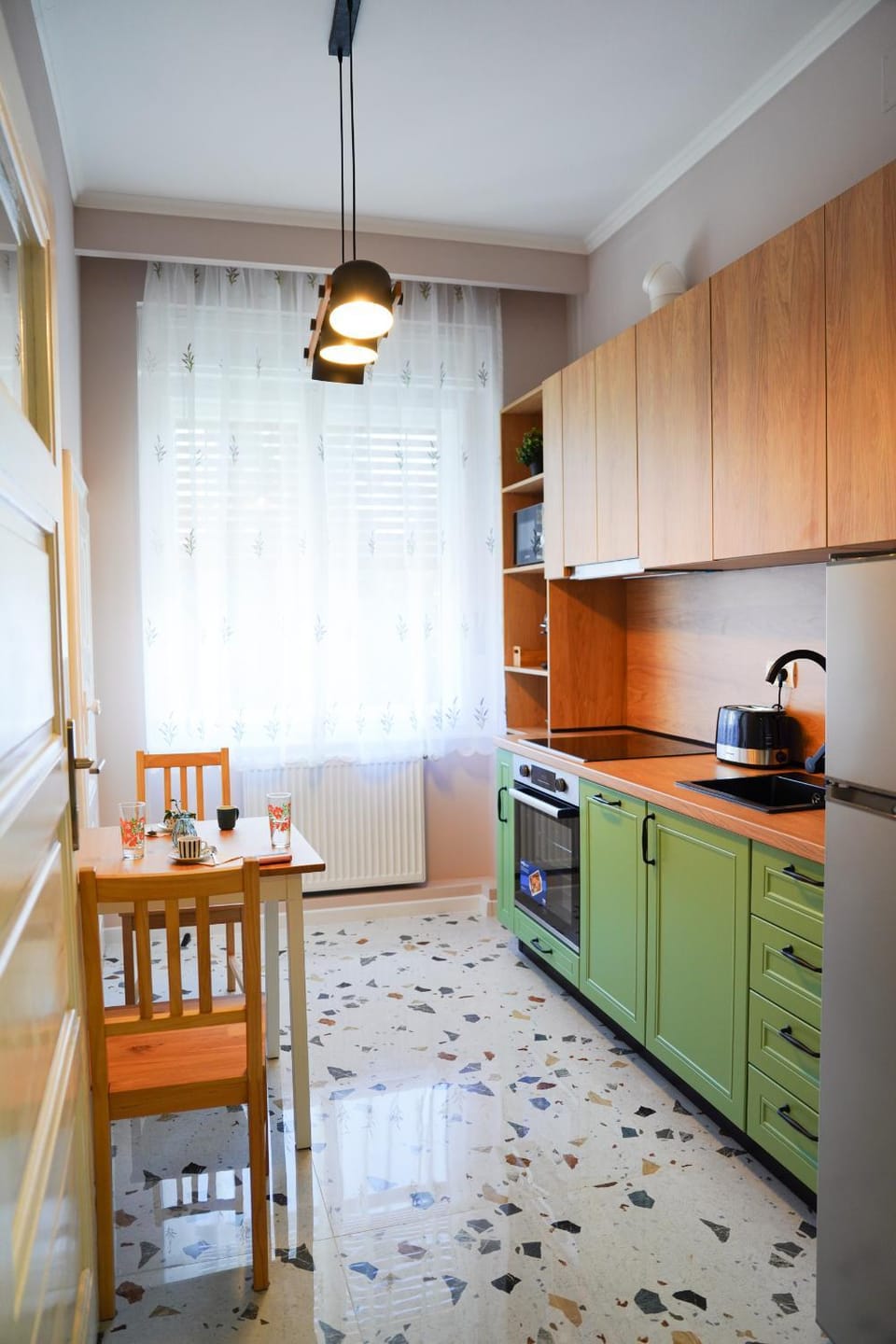 Kitchen or kitchenette, dishwasher, oven, stove