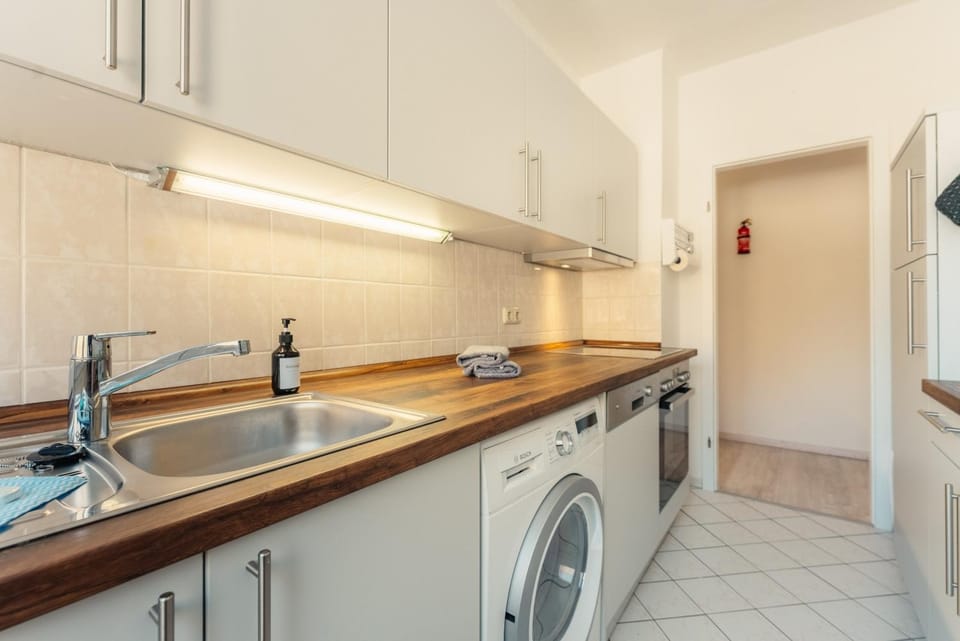 Kitchen or kitchenette, dishwasher, stove, washing machine