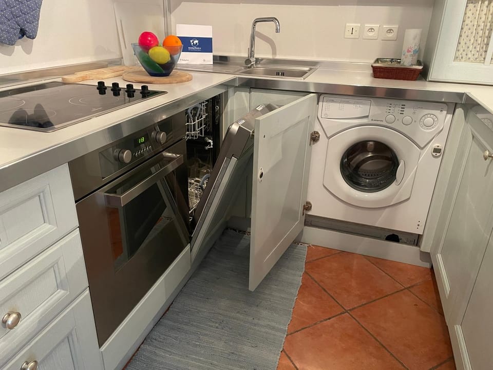 Kitchen or kitchenette, dishwasher, oven, stove, washing machine