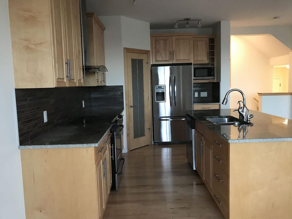 Kitchen or kitchenette, dishwasher, oven, stove