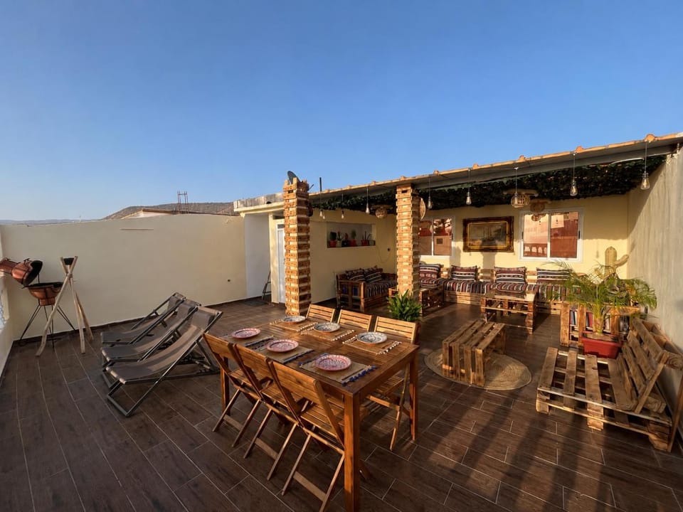Property building, Patio, Day, View (from property/room), Balcony/Terrace, Living room, Seating area, Dining area
