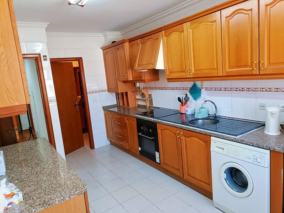 Kitchen or kitchenette, dishwasher, oven, stove, washing machine