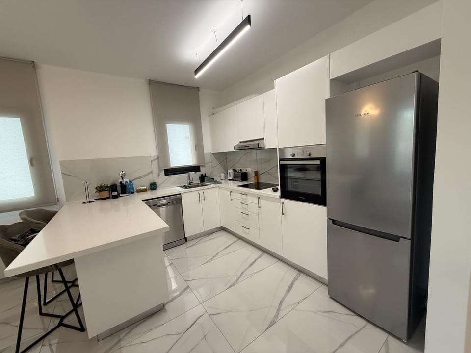 Kitchen or kitchenette, dishwasher, oven, stove, toaster