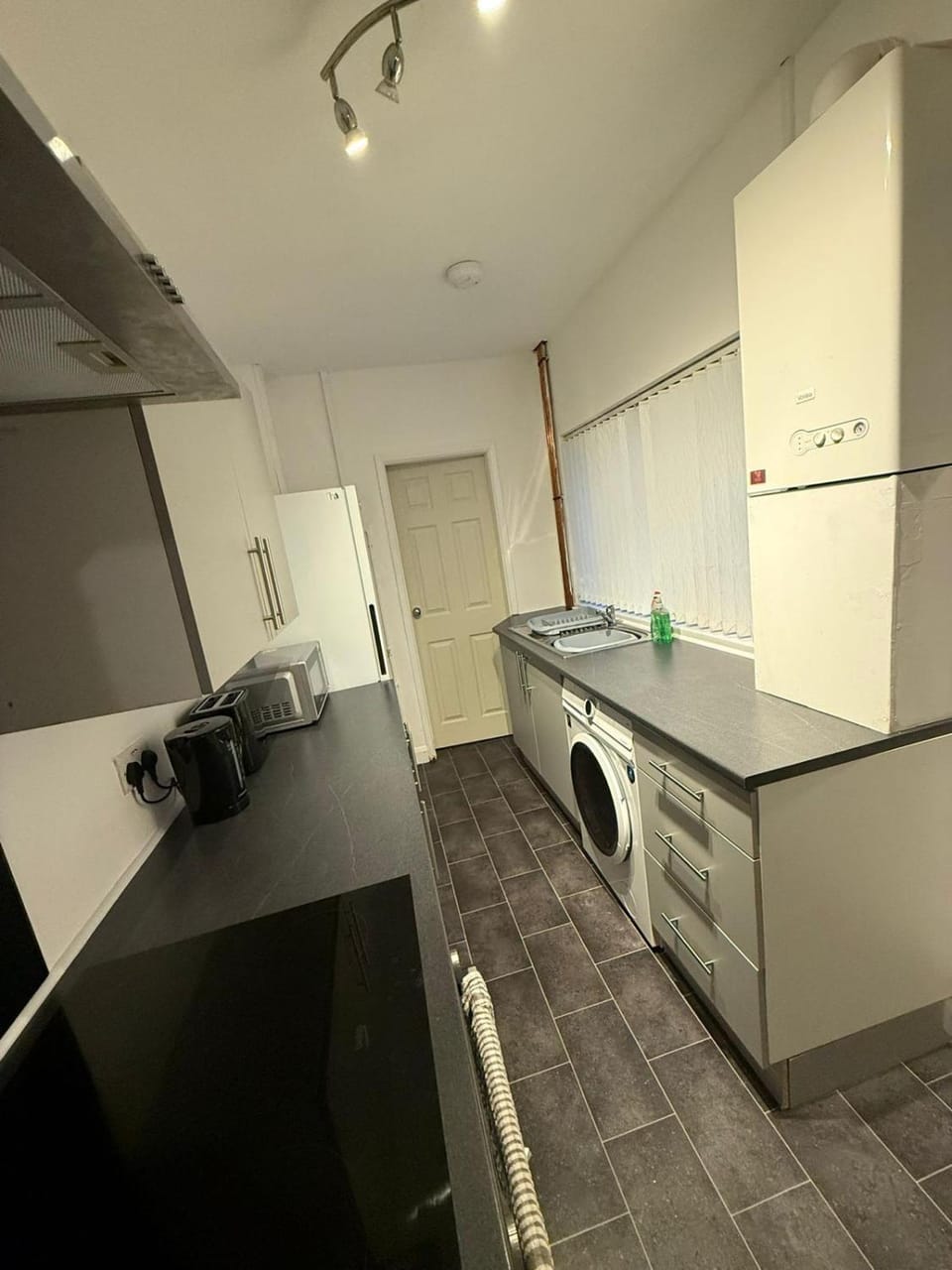 Kitchen or kitchenette, oven, stove, washing machine