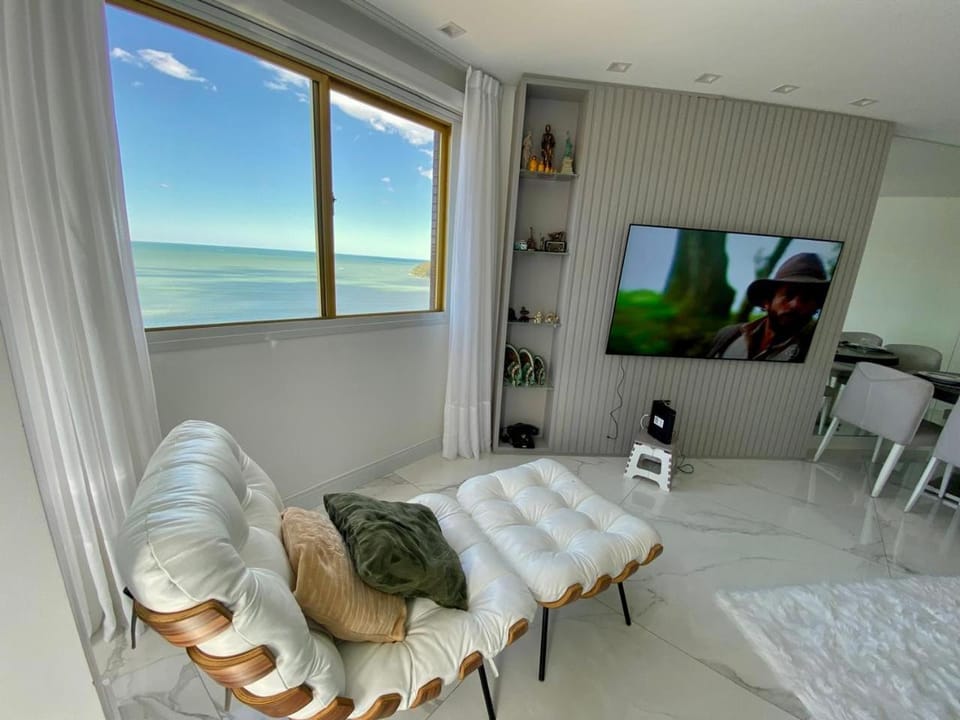 Communal lounge/ TV room, Natural landscape, TV and multimedia, Living room, Seating area, Sea view