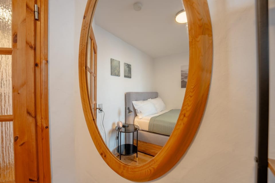 Bed, Living room, Seating area, Bedroom