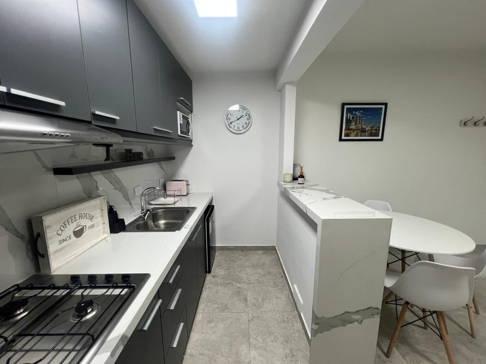 Kitchen or kitchenette, stove, toaster