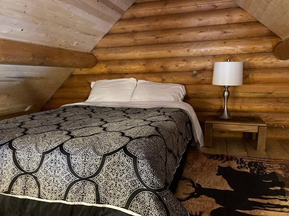 Lofted log cabin with fire table Cabin in British Columbia