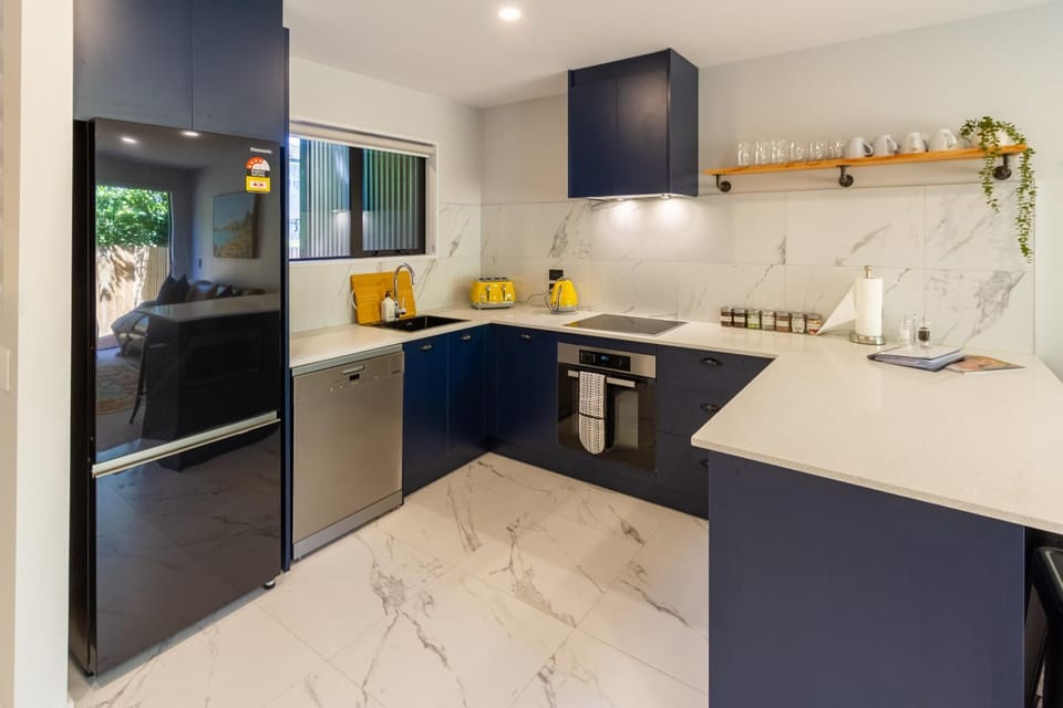 Kitchen or kitchenette, dishwasher, oven, stove