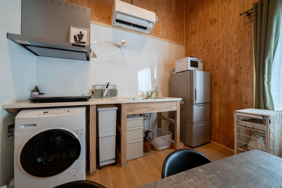 Kitchen or kitchenette, Dining area, stove, washing machine, dryer, air conditioner