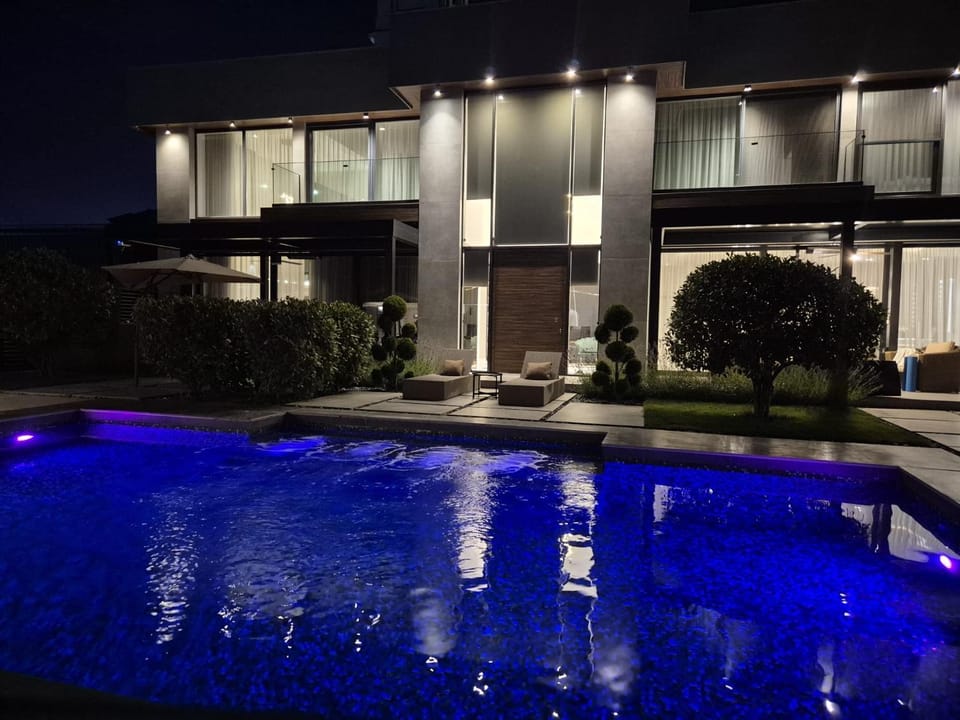 Property building, Night, View (from property/room), Pool view, Swimming pool