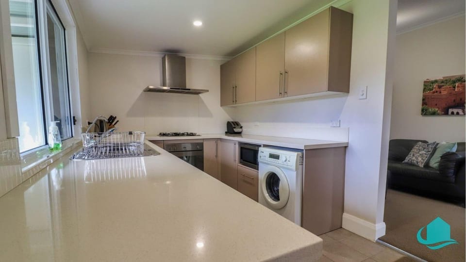 Kitchen or kitchenette, washing machine