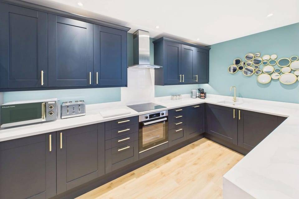 Kitchen or kitchenette, dishwasher, oven, stove