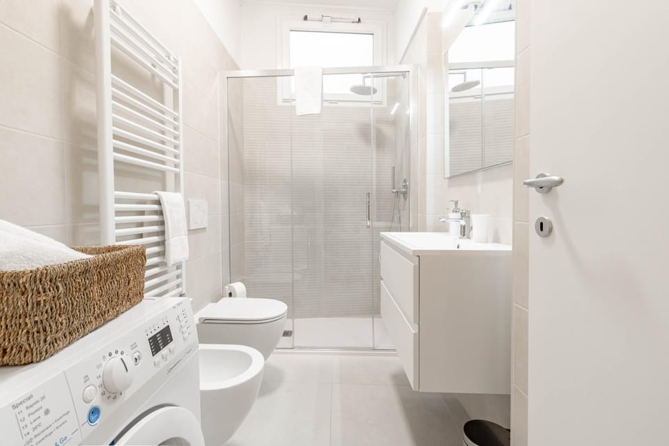 Shower, Toilet, Bathroom, bidet, towels, washing machine
