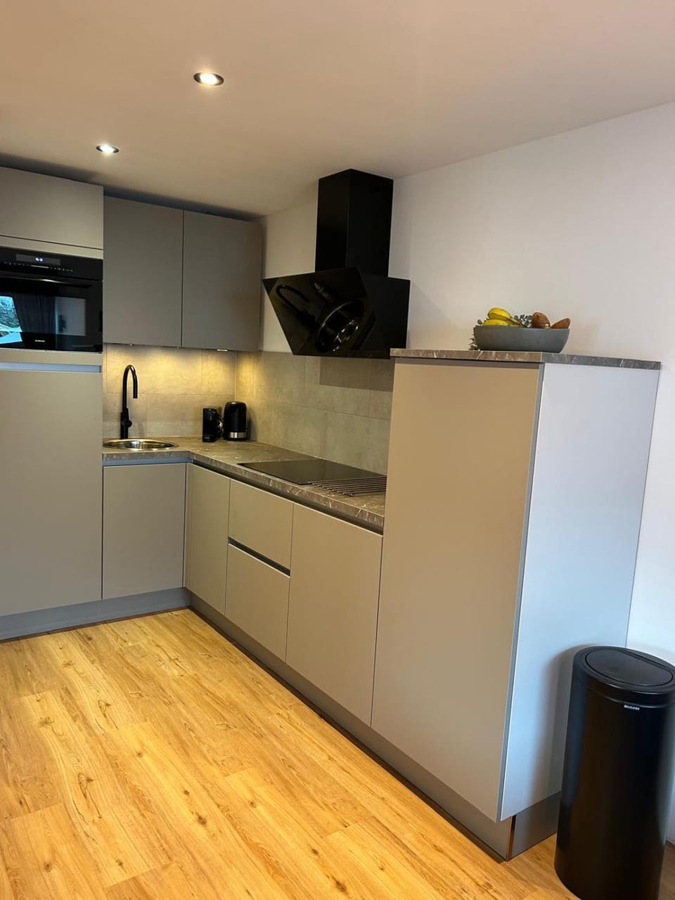 Kitchen or kitchenette, dishwasher, oven, stove