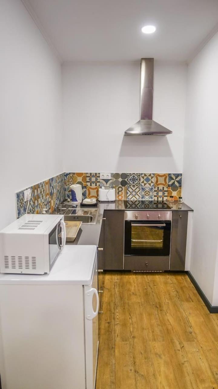 Kitchen or kitchenette, oven, stove, toaster