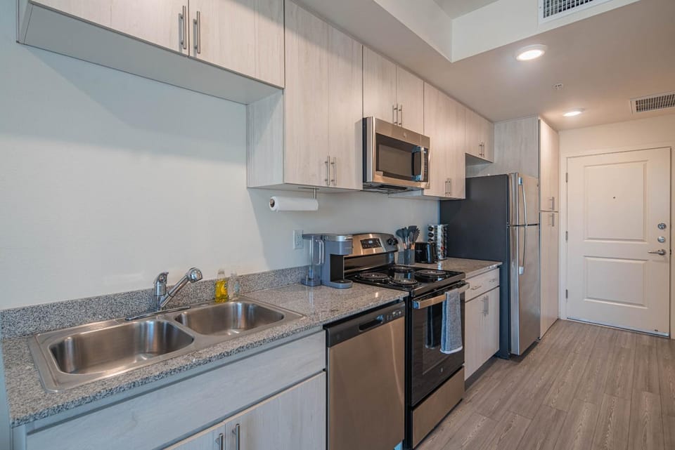 Kitchen or kitchenette, dishwasher, stove, toaster