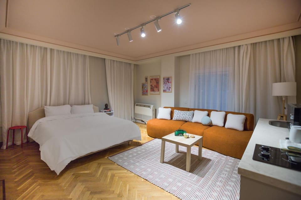 Bed, Living room, Seating area, Bedroom
