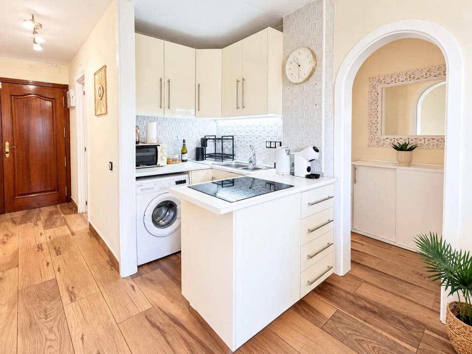 Kitchen or kitchenette, oven, stove, toaster, washing machine