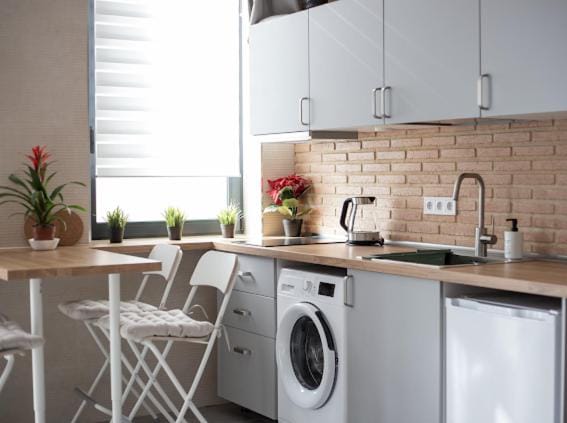 Kitchen or kitchenette, stove, washing machine