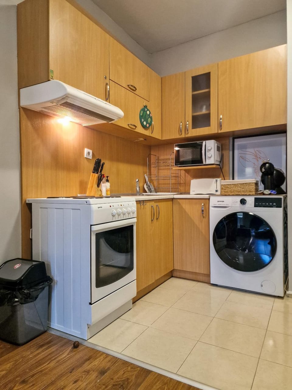 Kitchen or kitchenette, stove, toaster, washing machine